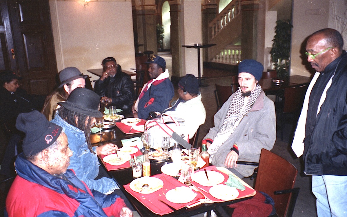 Rolando Alphonso, Lloyd Brevett, Mazhar, Lloyd Knibb, Devon James, Lester Sterling, Ras Claude at a table somewhere in Helsinki, Finland 1996